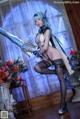 A woman in lingerie holding a sword in front of flowers.